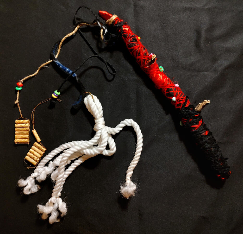 Which cat? Which cat? An extremely elaborate and colorful fishing rod style cat toy.
