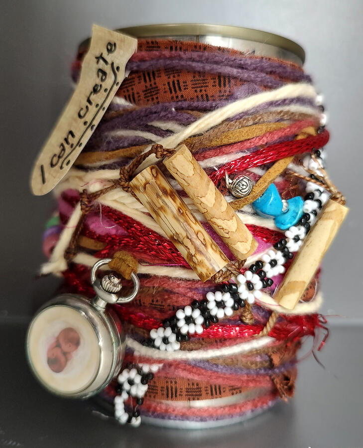 I can can I can can - a soup can wrapped with colorful yarn and intricate decorations